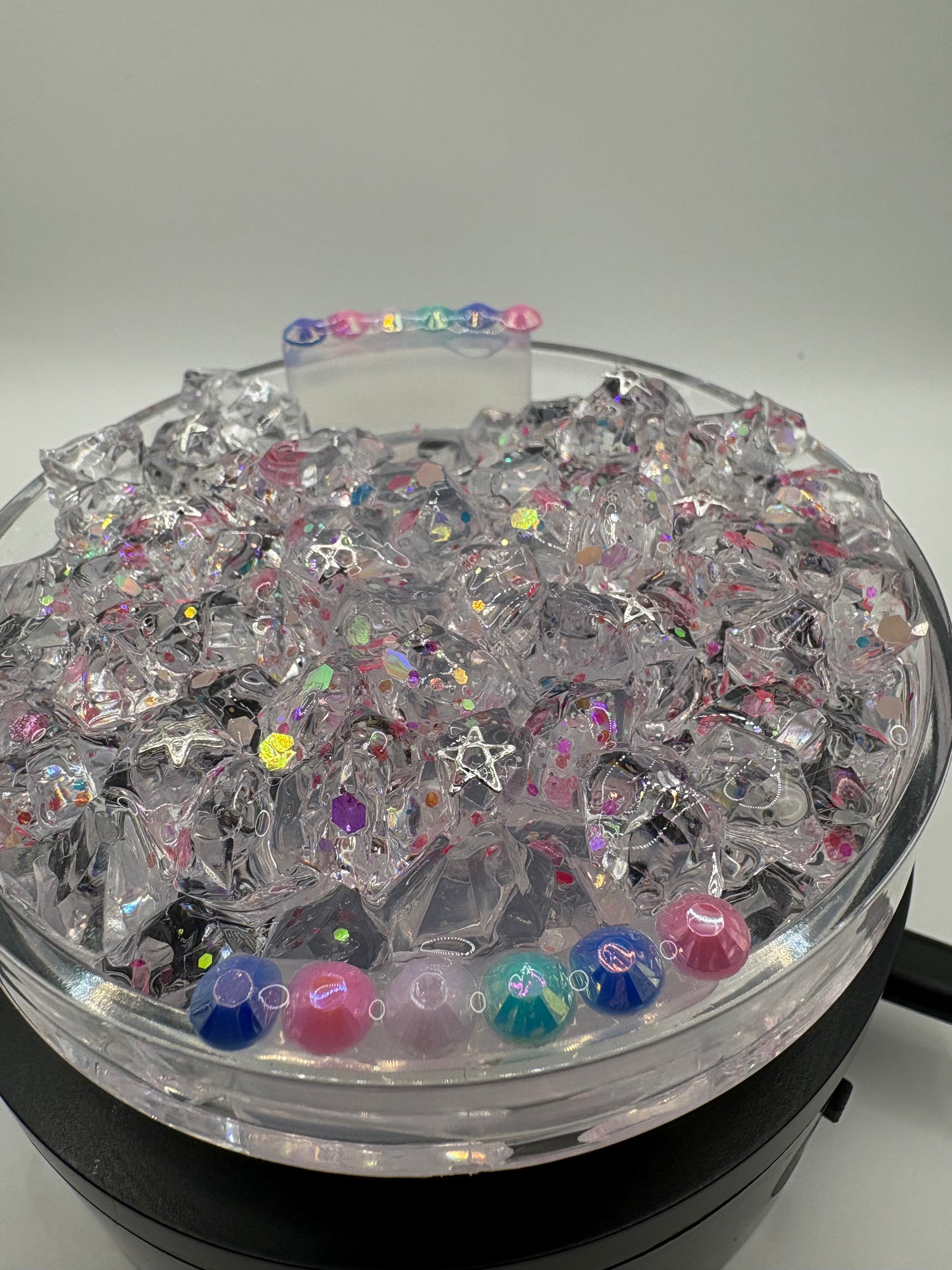 Decorated lid with charms(no ice ..add ice if want ice )